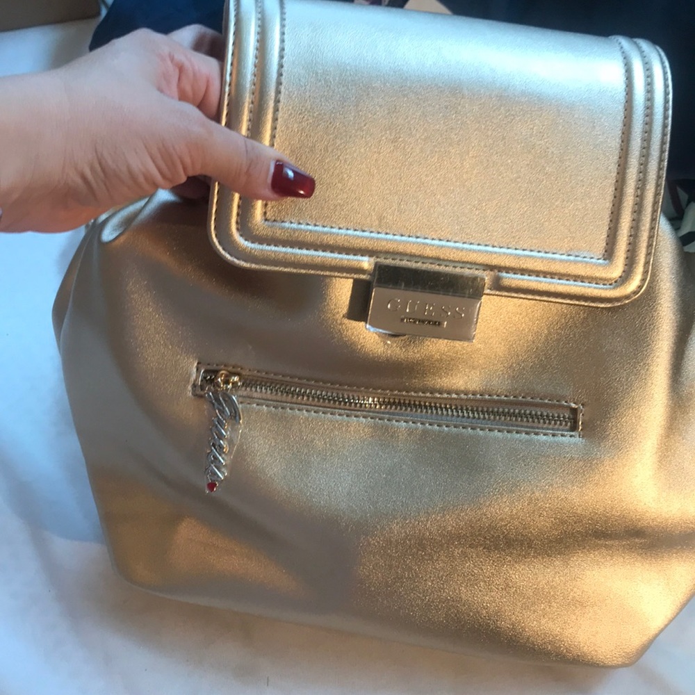 Brand New, Guess backpack in Gold color